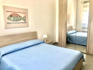 Ein Bett oder Betten in einem Zimmer der Unterkunft Casa Gio - Appartamenti Vacanze