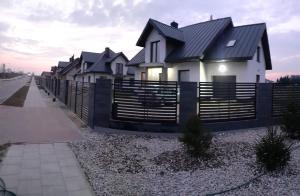 a row of houses on the side of a road at Apartament na Glinkach 22 in Augustów