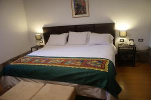 Postel nebo postele na pokoji v ubytování Hotel Samanapaq