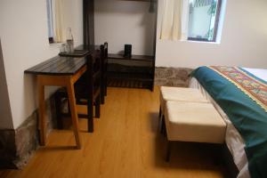 Postel nebo postele na pokoji v ubytování Hotel Samanapaq
