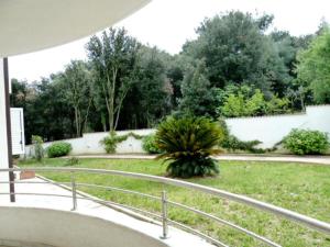 a view of a garden from the balcony of a house at Apartment Allegra in Banjole