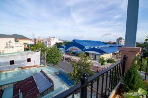a view from a balcony of a street with a building at Hacoda Homestay in Con Dao