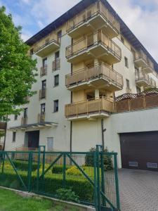 a building with balconies on the side of it at Kawalerka u Mirka in Świnoujście