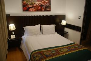 Postel nebo postele na pokoji v ubytování Hotel Samanapaq