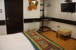 Postel nebo postele na pokoji v ubytování Hotel Samanapaq