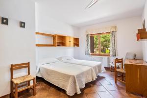 Postel nebo postele na pokoji v ubytování Es Bosquet