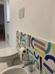 a bathroom with a sink and a toilet at CasaTua in Amalfi
