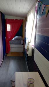 Tempat tidur dalam kamar di LA PARENTHESE