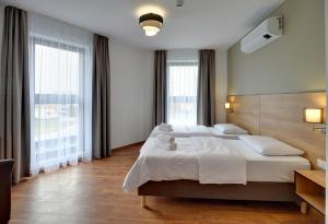 Łóżko lub łóżka w pokoju w obiekcie Nocleg EM