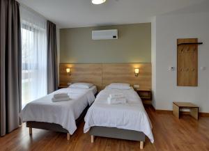Łóżko lub łóżka w pokoju w obiekcie Nocleg EM
