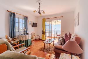 a living room with a couch and a table at Apartamento Fuencaliente (Casa Los Bejeques) in Fuencaliente de la Palma