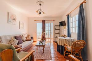 a living room with a couch and a table at Apartamento Fuencaliente (Casa Los Bejeques) in Fuencaliente de la Palma