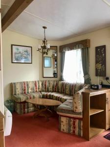 a living room with a couch and a table at BLICK in Lądek-Zdrój