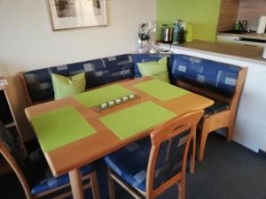 a table and chairs with a game controller on it at Gipfelzauber in Braunlage