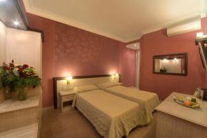 Кровать или кровати в номере Hotel Galileo