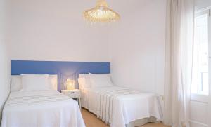 Postel nebo postele na pokoji v ubytování Hostal La Calzada