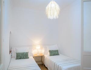 Postel nebo postele na pokoji v ubytování Hostal La Calzada