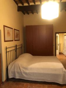 מיטה או מיטות בחדר ב-Casa di Silvia
