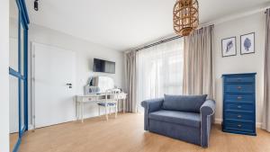 Televízia a/alebo spoločenská miestnosť v ubytovaní Villa Kurort