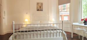 Krevet ili kreveti u jedinici u okviru objekta Gloucester Garden in South Kensington