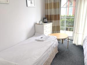 Posteľ alebo postele v izbe v ubytovaní 404 Rooms Wilanowska