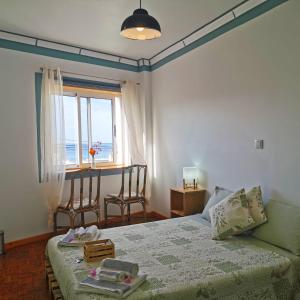 Кровать или кровати в номере The Handmade House Azores