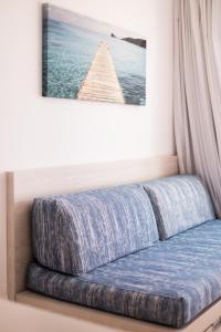 a bed sitting next to a window in a room at Apartamentos Avenida - MC Apartamentos Ibiza in Ibiza Town