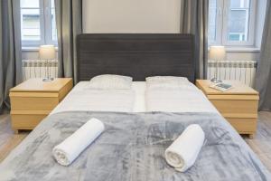 Posteľ alebo postele v izbe v ubytovaní Apartament pod Twierdzą