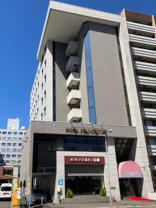 a building with a sign on the side of it at Hotel Hamilton Sapporo in Sapporo