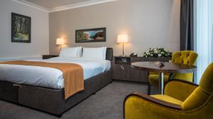 Uma cama ou camas num quarto em Hotel Kilmore