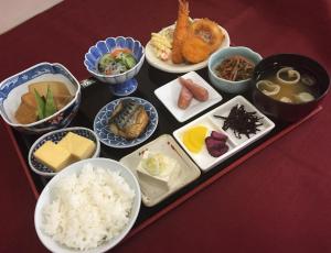 a tray of different types of food on a table at Hotel Hamilton Sapporo in Sapporo