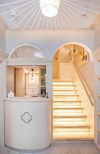a hallway with a white door and a white toilet at Heritage Villa Nobile in Dubrovnik