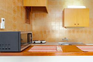 A kitchen or kitchenette at Apartamentos Puet