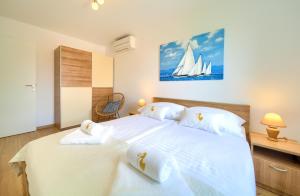 Postel nebo postele na pokoji v ubytování Dodo Apartments