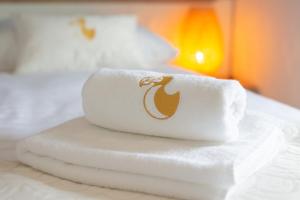 Postel nebo postele na pokoji v ubytování Dodo Apartments