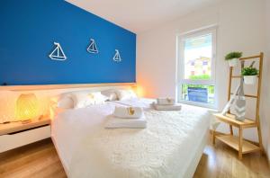 Postel nebo postele na pokoji v ubytování Dodo Apartments