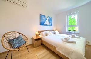 Postel nebo postele na pokoji v ubytování Dodo Apartments