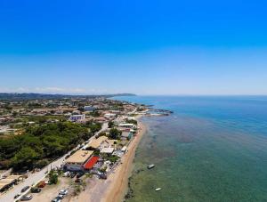 an aerial view of a beach next to the ocean at Kaloudis family in Agios Georgios