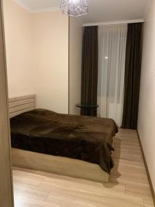 Кровать или кровати в номере Melikishvili str. apartment