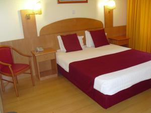 Cama ou camas em um quarto em Hotel Solneve