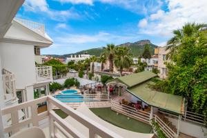 an apartment balcony with a view of a pool at Castello Hotel & Aparts in Kemer