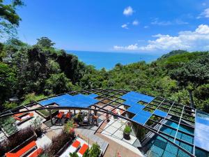 an aerial view of a building with a view of the ocean at Makanda by The Sea Hotel Adults Only in Manuel Antonio