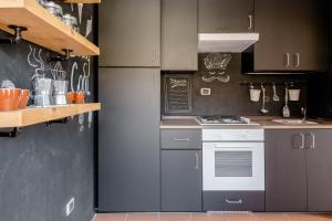 A kitchen or kitchenette at Casa Lu Maccu - Sea View Apartment