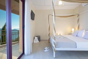 a bedroom with a bed and a balcony at Nikolas Guest House Villa in Nikiana