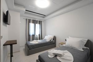 TV a/nebo společenská místnost v ubytování Orion Eco Suites