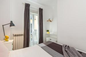 Posteľ alebo postele v izbe v ubytovaní Waou La Latina II - Alquiler Corta Duración