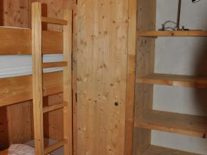 a room with wooden walls and bunk beds at Appartement Les Deux Alpes, 5 pièces, 8 personnes - FR-1-348-173 in Les Deux Alpes