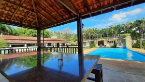 a view of a house with a swimming pool at Pousada Recanto Por do Sol in Morungaba