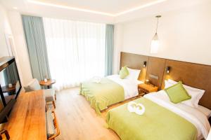 Letto o letti in una camera di Jinling Onejoy Hotel