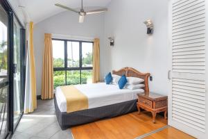 Postel nebo postele na pokoji v ubytování Dreamcatcher Beach-Side Apartments